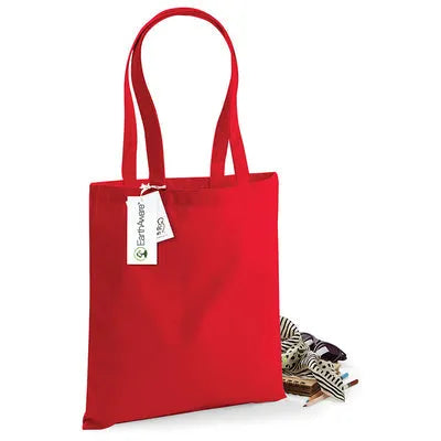 Red organic cotton tote bag with a tag on a white background