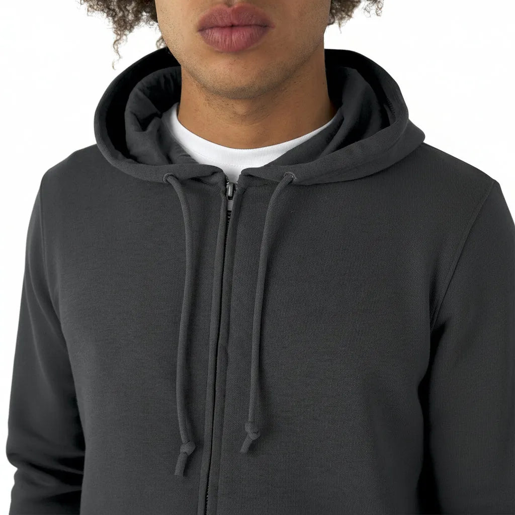 Person wearing a dark gray hoodie on a white background