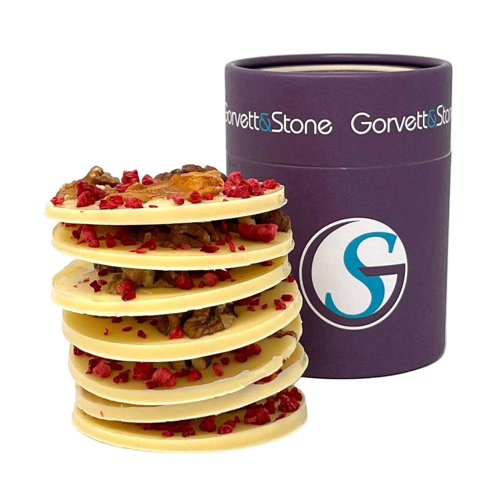 Stack of sustainable white chocolate discs with red fruits next to a purple Gorrett & Stone container on a white background