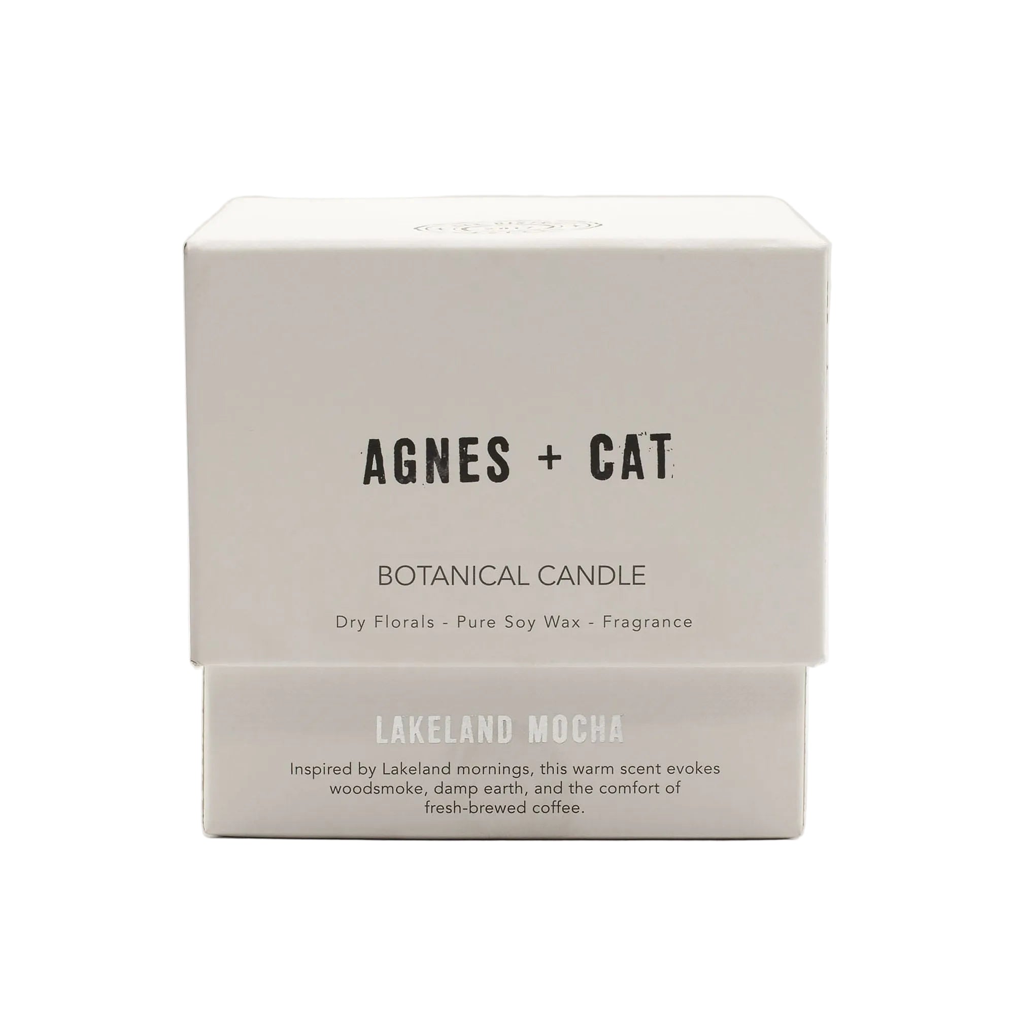 Agnes + Cat botanical candle packaging on a white background