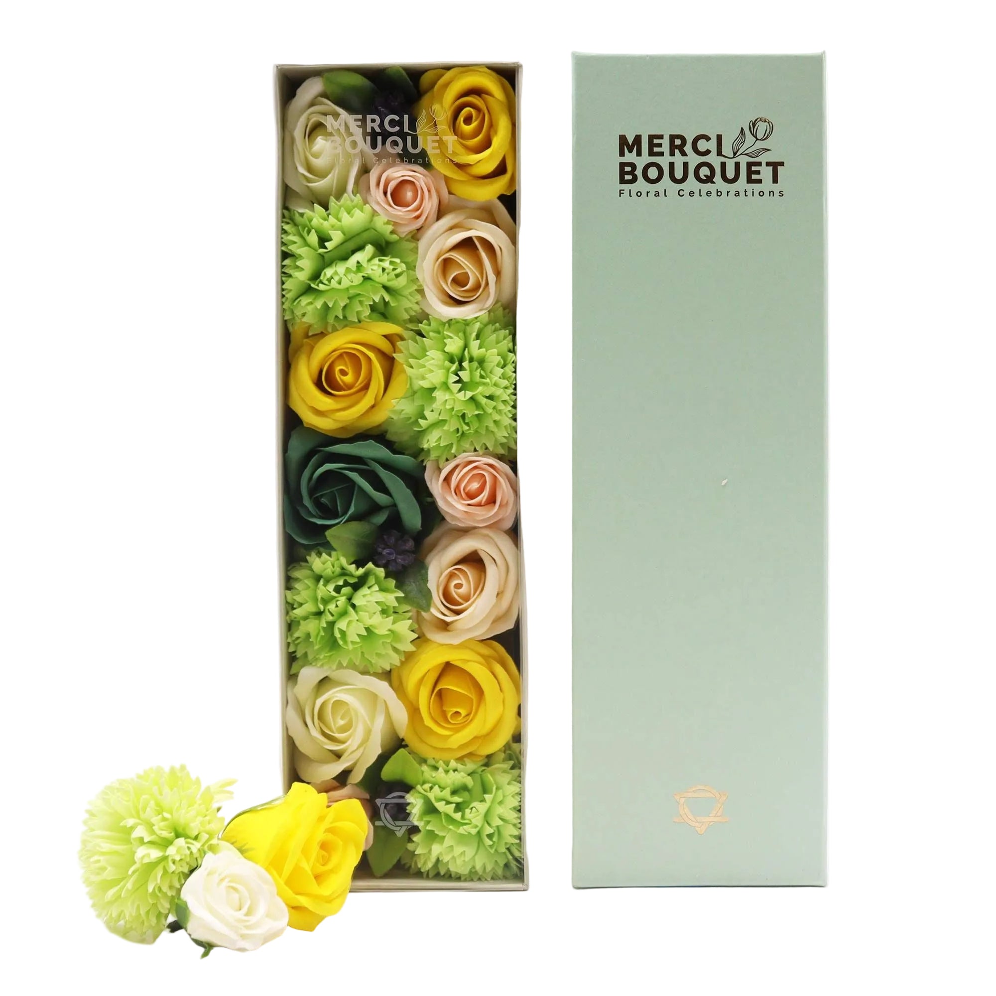 Colourful soap flower arrangement in a Merci Bouquet box on a white background