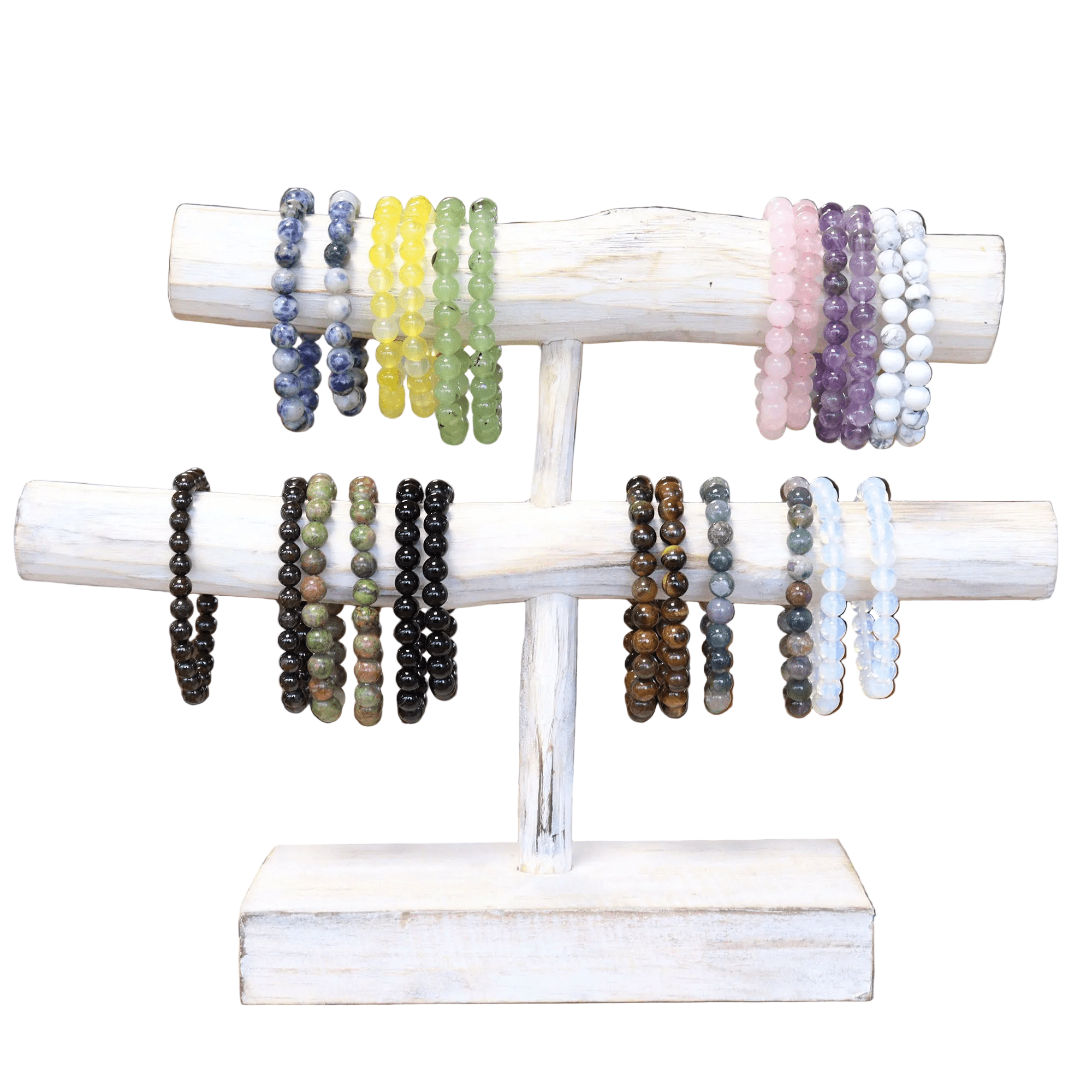 Set of beaded bracelets on a white wooden stand with a white background