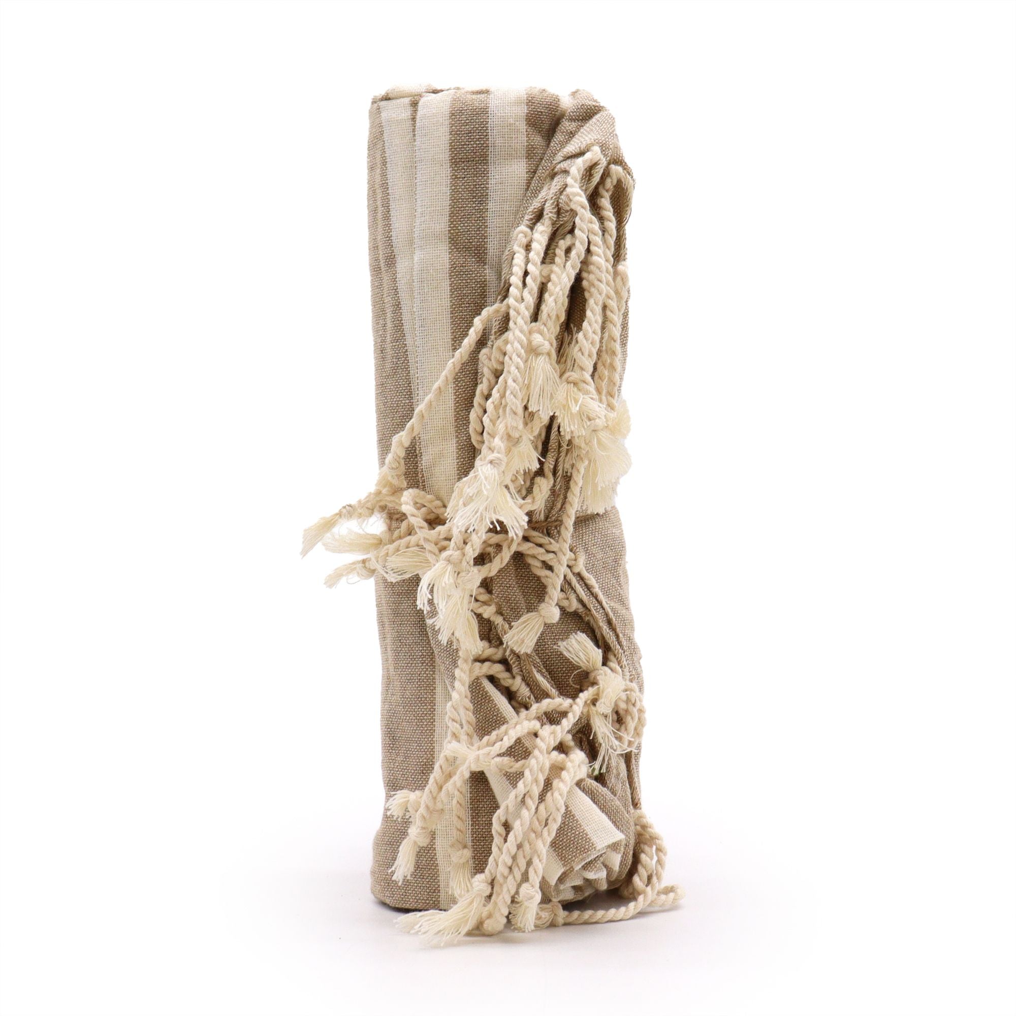 Beige towel with tassels on a white background