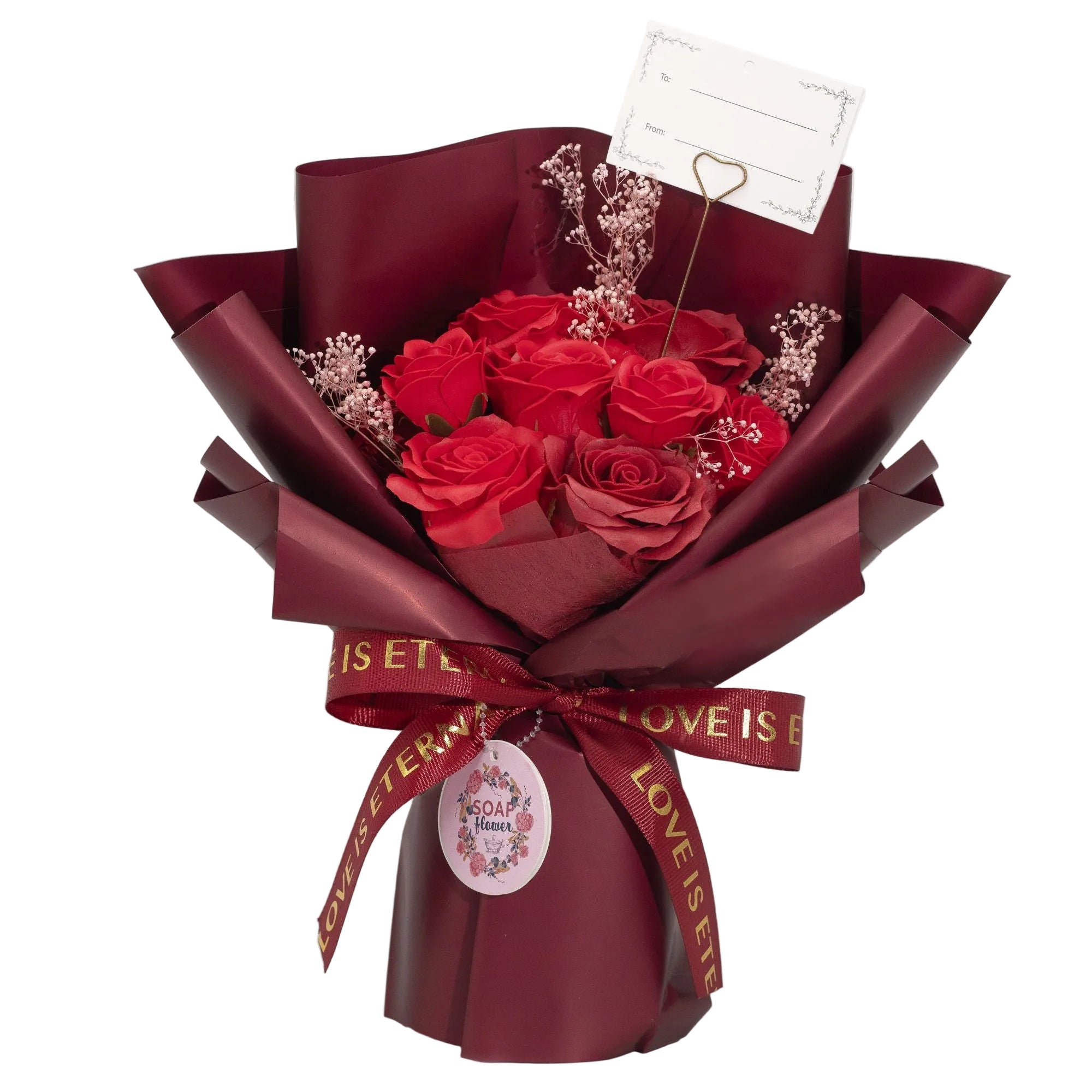 Bouquet of red rose soap wrapped in burgundy paper with a decorative ribbon on a white background