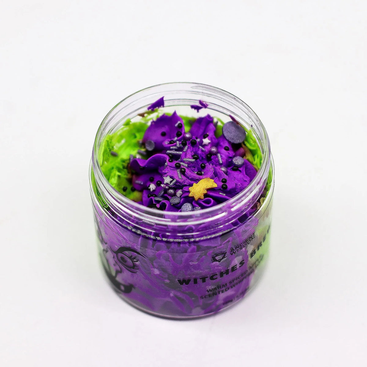 Jar of purple and green Halloween soap with decorative elements on a white background