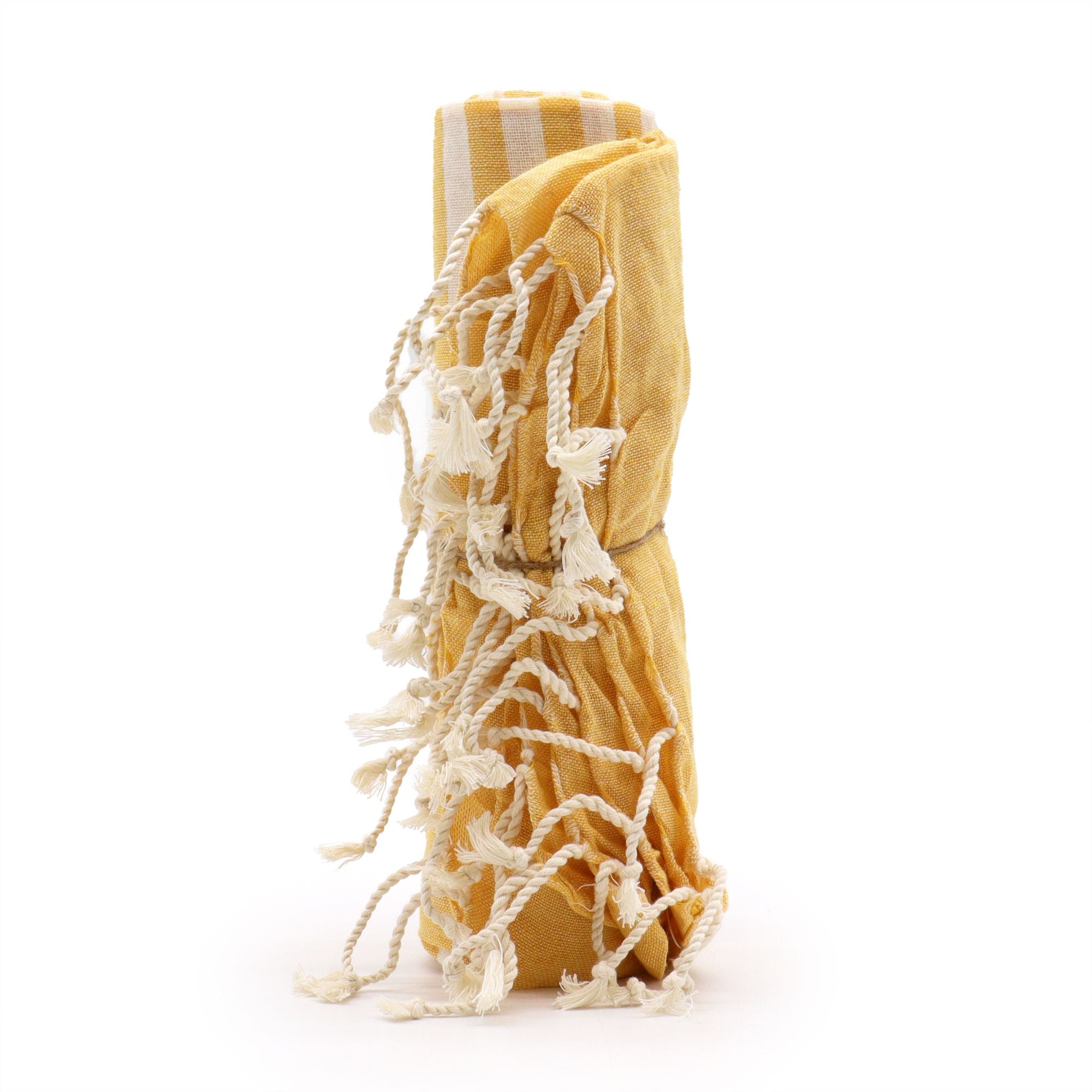 Yellow and white striped towel with tassels on a white background