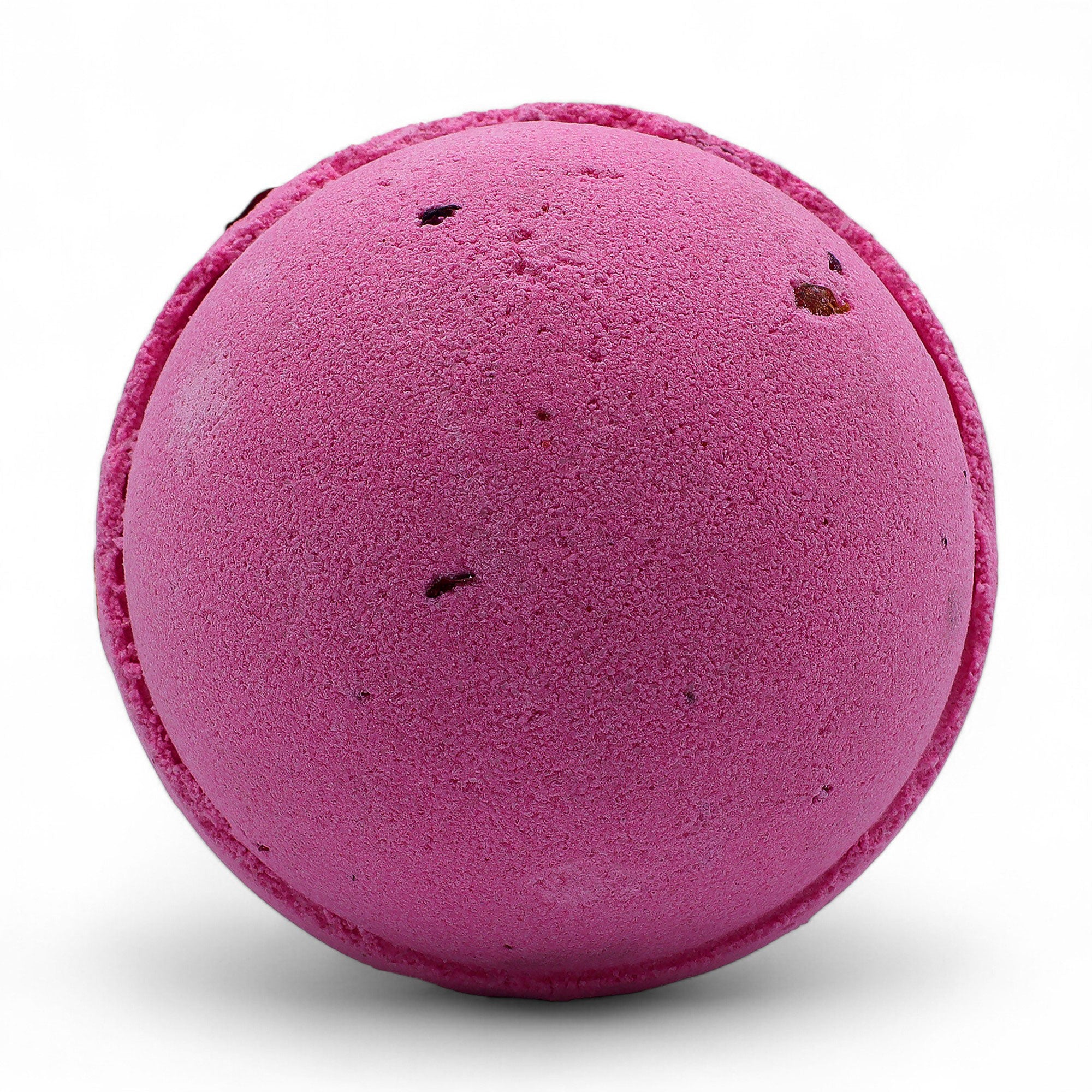 Pink bath bomb on a white background