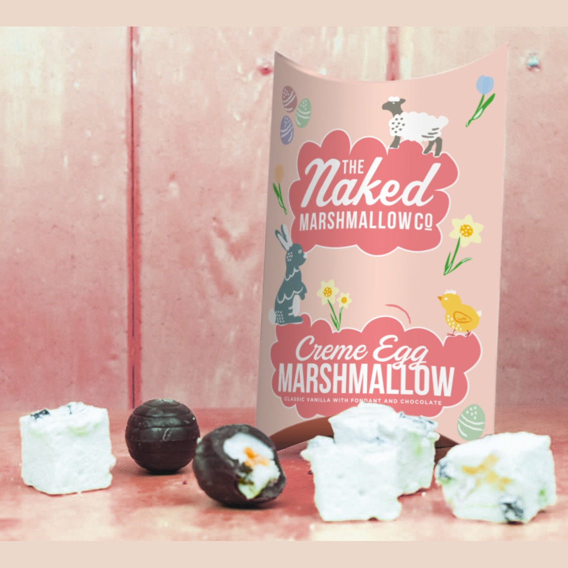 Naked Marshmallow Co. Creme Egg marshmallows with packaging on a pink background