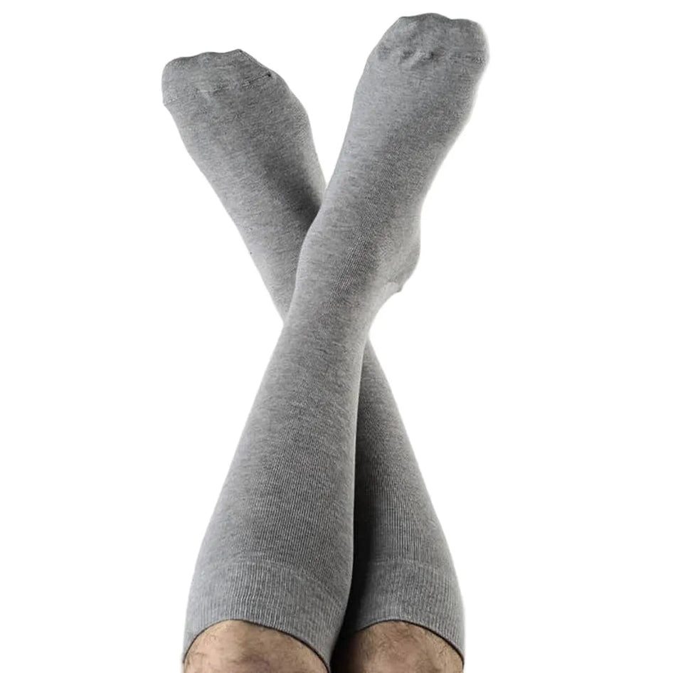 Gray knee-high socks worn by a person on a white background