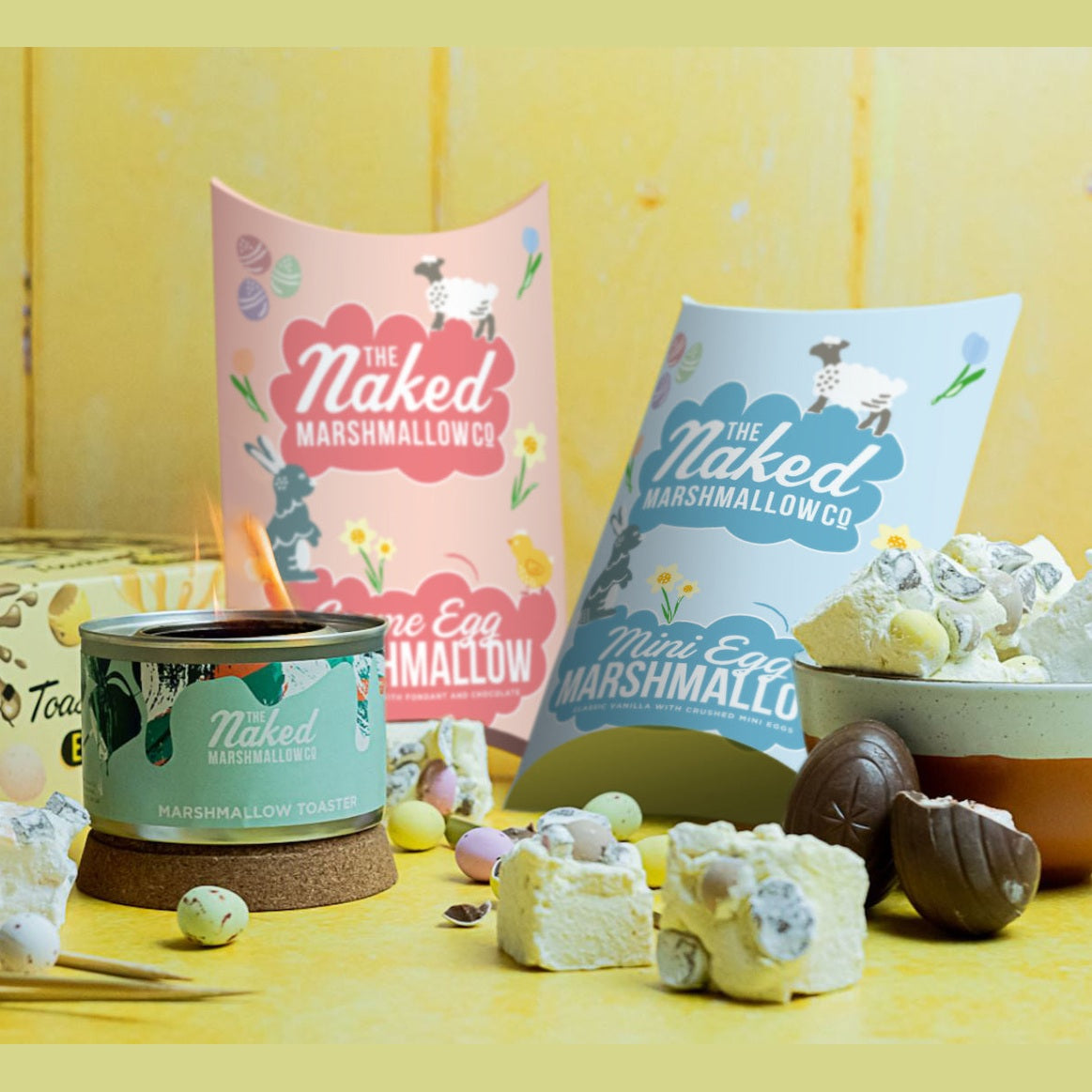 Naked Marshmallow Co products including marshmallows and packaging on a yellow background