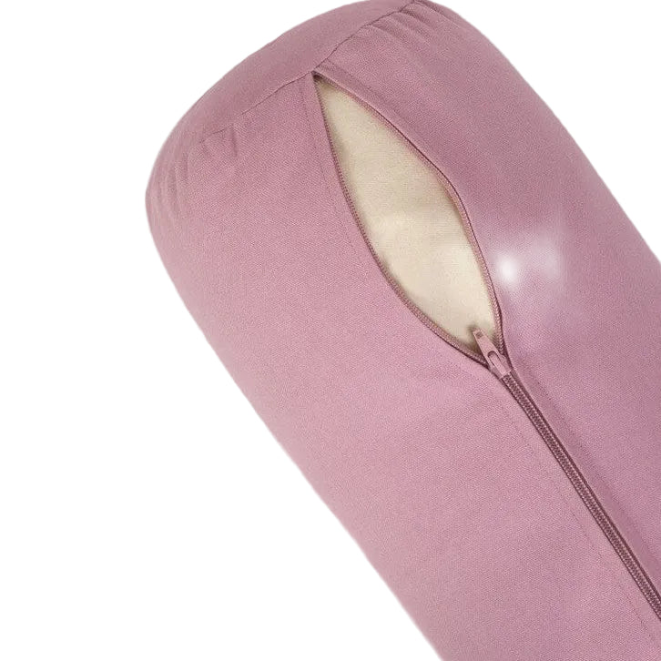 Pink yoga bolster with a zipper on a light gray background