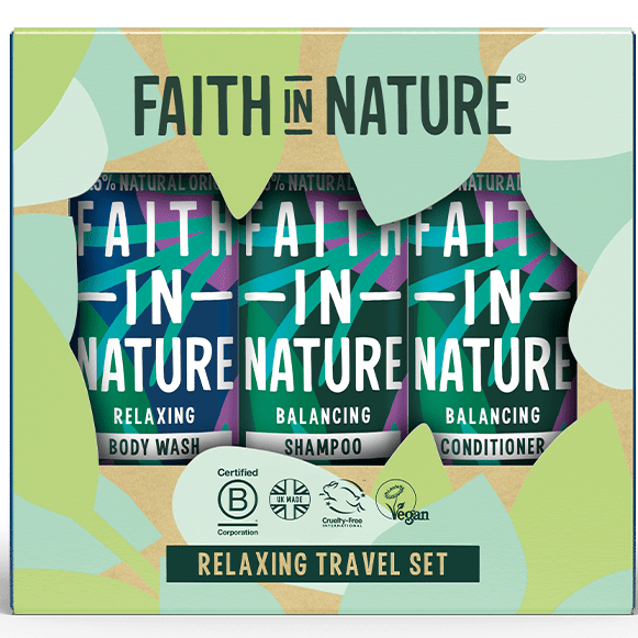 Faith in Nature Relaxing Travel Set containing three travel-sized bottles of body wash, shampoo, and conditioner in a decorative green and beige gift box.