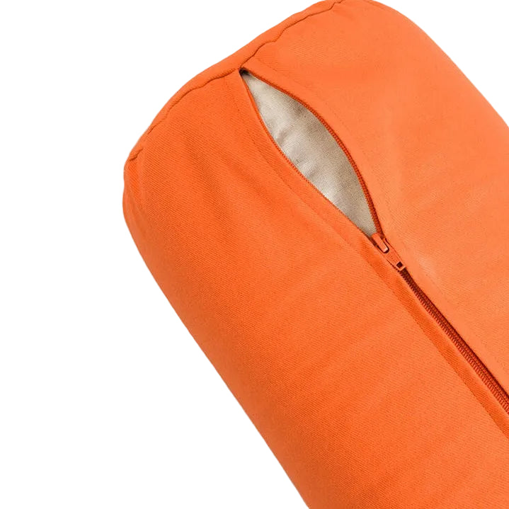Orange pillow with a zipper on a light gray background