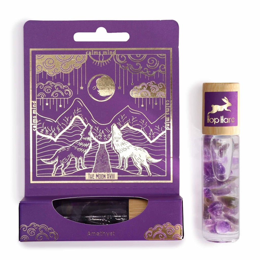 Emmy Jane - Essential Oil Gemstone Roll On - Hop Hare - Made in the UK. Each Hop Hare roll-on bottle features a specially selected essential oil blend, chosen for its aromatic properties that synergize with the gemstone power. This magical pairing creates a double force, boosting the holistic benefits of both elements.The extra layer of magic is a detachable gold-printed tarot card that unveils a world of storytelling.