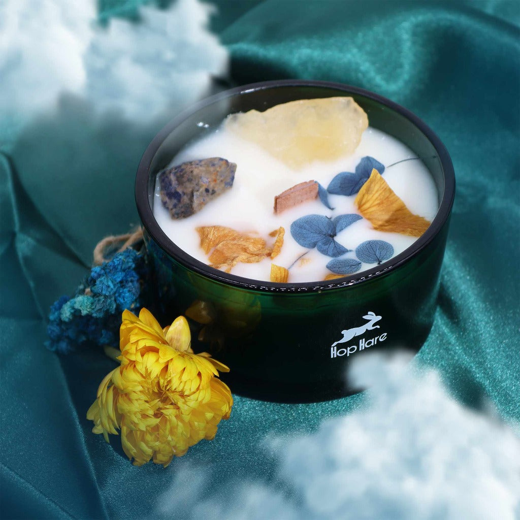 Crystal Magic Flower Candles - Hop Hare Botanical Gemstone Candles. Hop Hare Crystal magic flower candles offer a chance to embrace enchantment. Unveil the enchantment upon opening the box. A hidden tarot card reveals candles adorned with real gemstones and flowers.