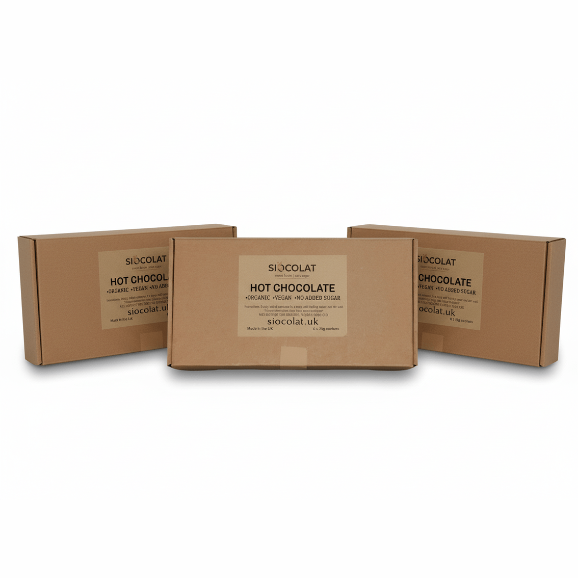 Three cardboard boxes of SIOCOLAT hot chocolate on a white background