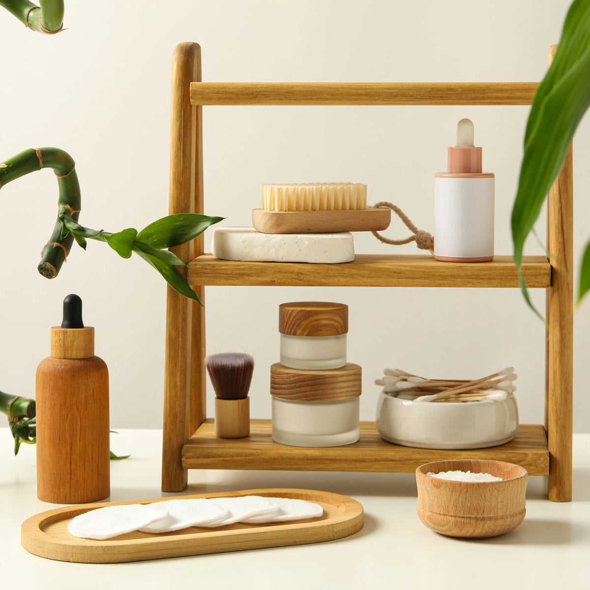 Natural plastic-free bathroom products displayed on a wooden shelf with bamboo and skincare essentials