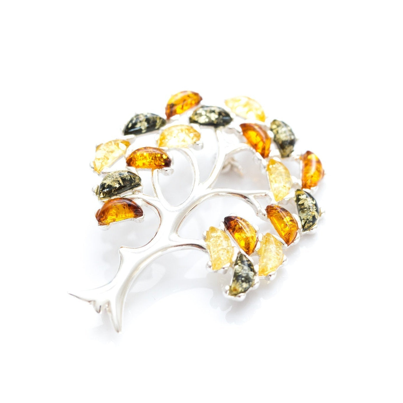 Silver brooch with multicolored gemstones on a white background