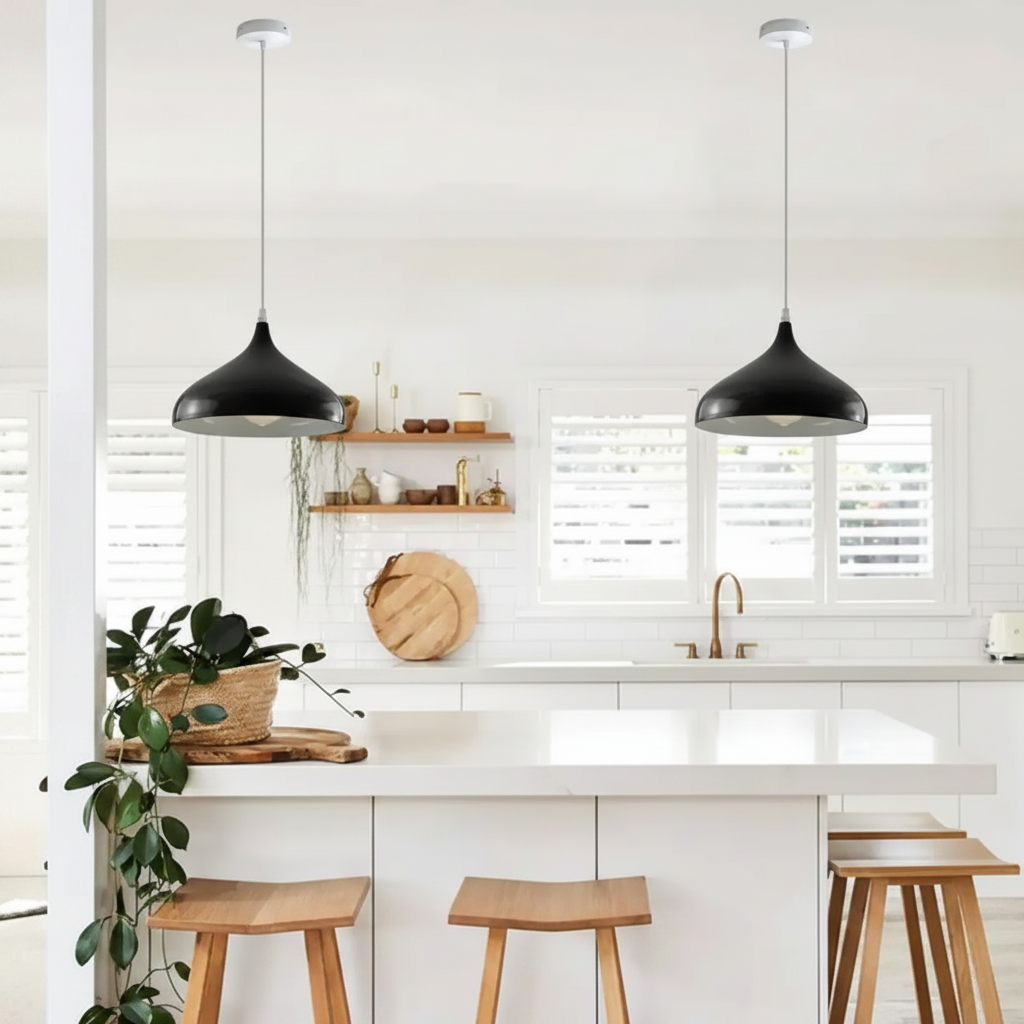 Black Retro Industrial Metal Dome Lampshade hanging in a bright modern white kitchen with wooden bar stools and green plants