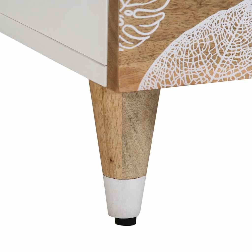 Close-up of a wooden furniture leg with a white base and a decorative leaf design on a white background
