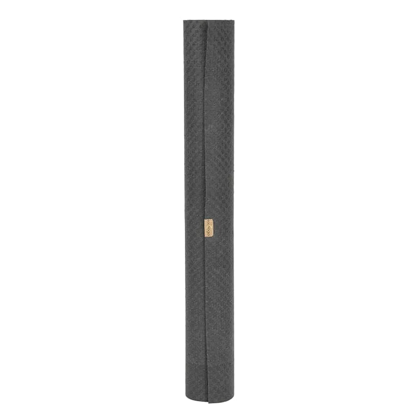 Grey textured eco yoga mat with a gold tag on a white background