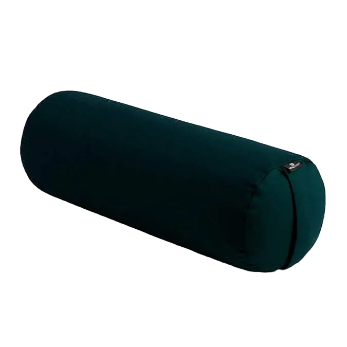 Dark green yoga bolster on a light gray background