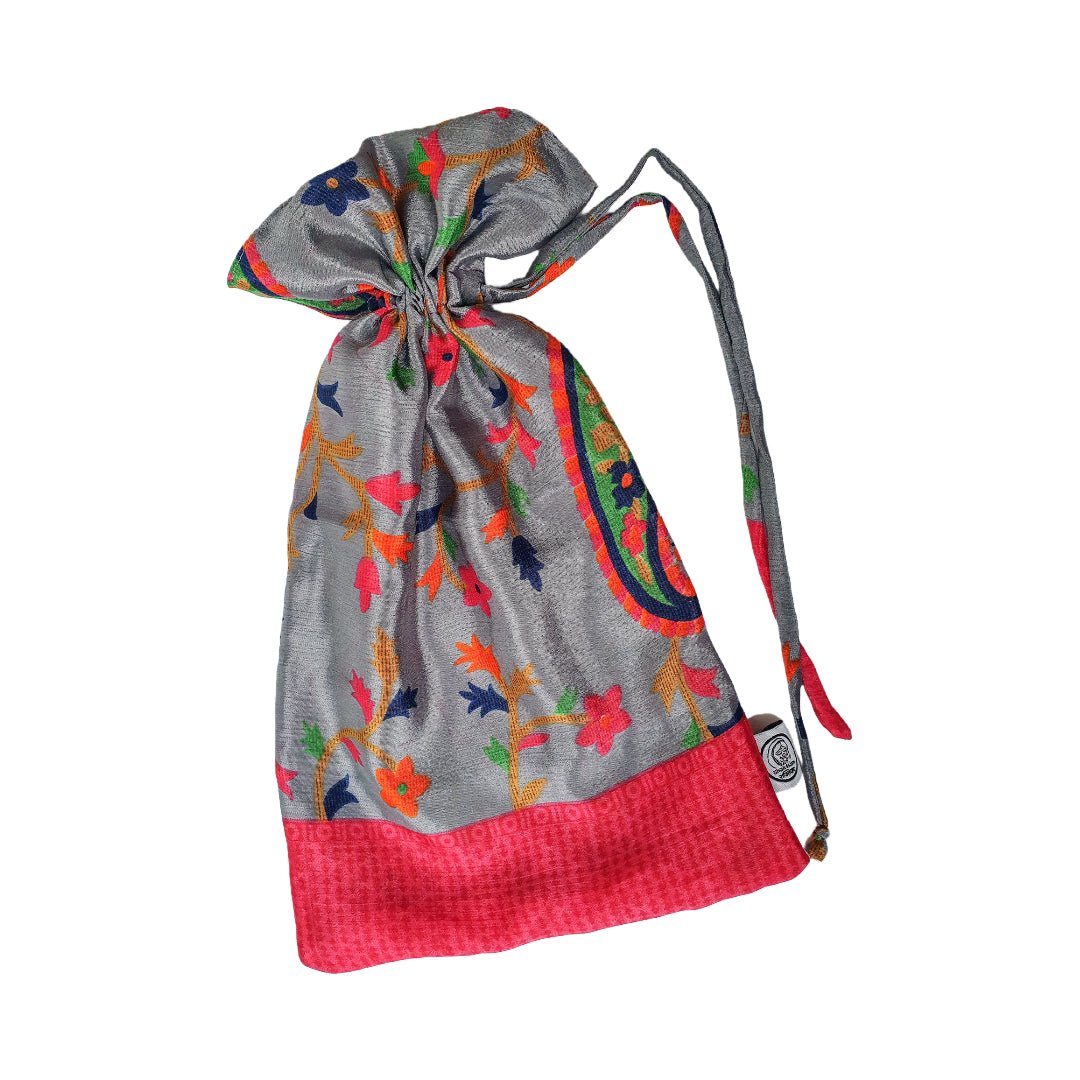 Decorative bag with colorful floral patterns on a gray background
