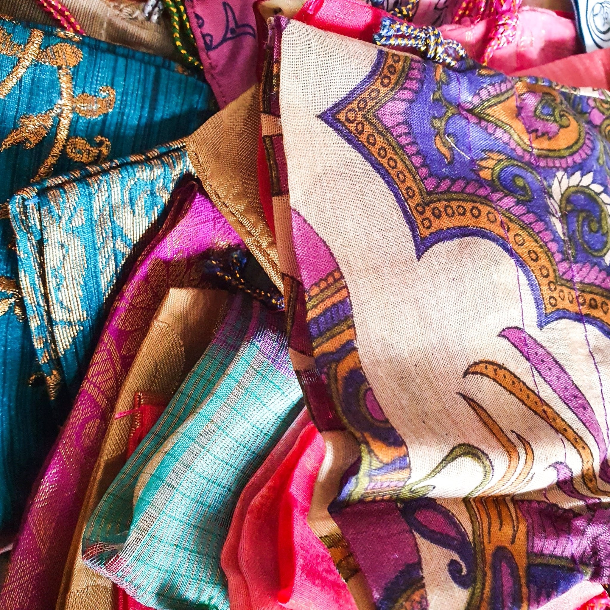 Close-up of colorful fabric with intricate patterns and designs.