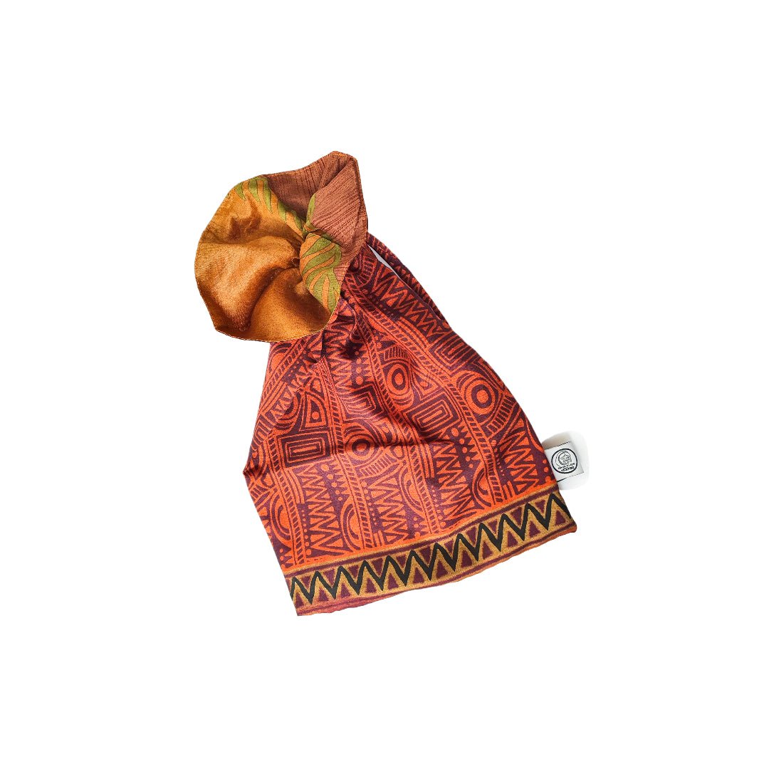 Colorful patterned fabric with a brand tag on a white background