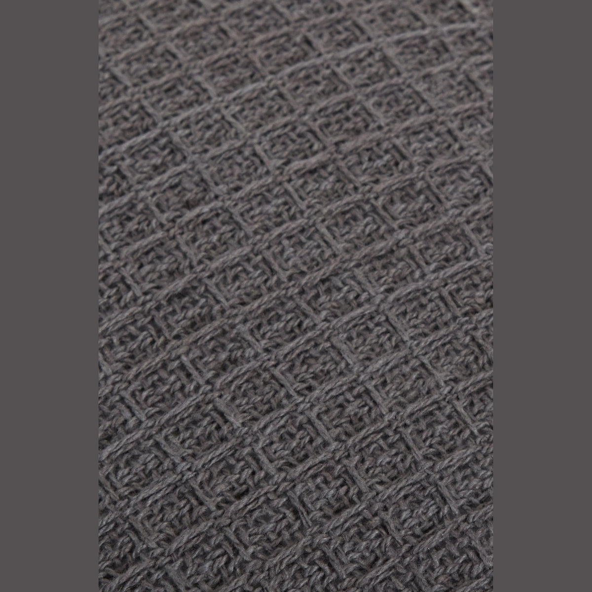 Handwoven Honeycomb Vibrant Cushion Cover close-up dark grey