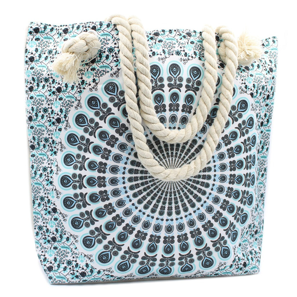 Emmy Jane - Large Beach Bag - Rope Handled Mandela Shopper Bag - Blue Shades. This charmingly patterned Mandala Bag is large enough for storing all of your essentials. This attractive bag has a small pocket inside, two shoulder straps, and a fastening at the top with a zip. Perfect for shopping and also for the beach.