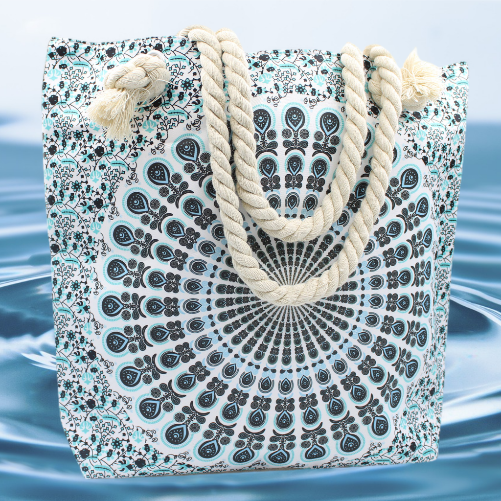 Emmy Jane - Large Beach Bag - Rope Handled Mandela Shopper Bag - Blue Shades. This charmingly patterned Mandala Bag is large enough for storing all of your essentials. This attractive bag has a small pocket inside, two shoulder straps, and a fastening at the top with a zip. Perfect for shopping and also for the beach.