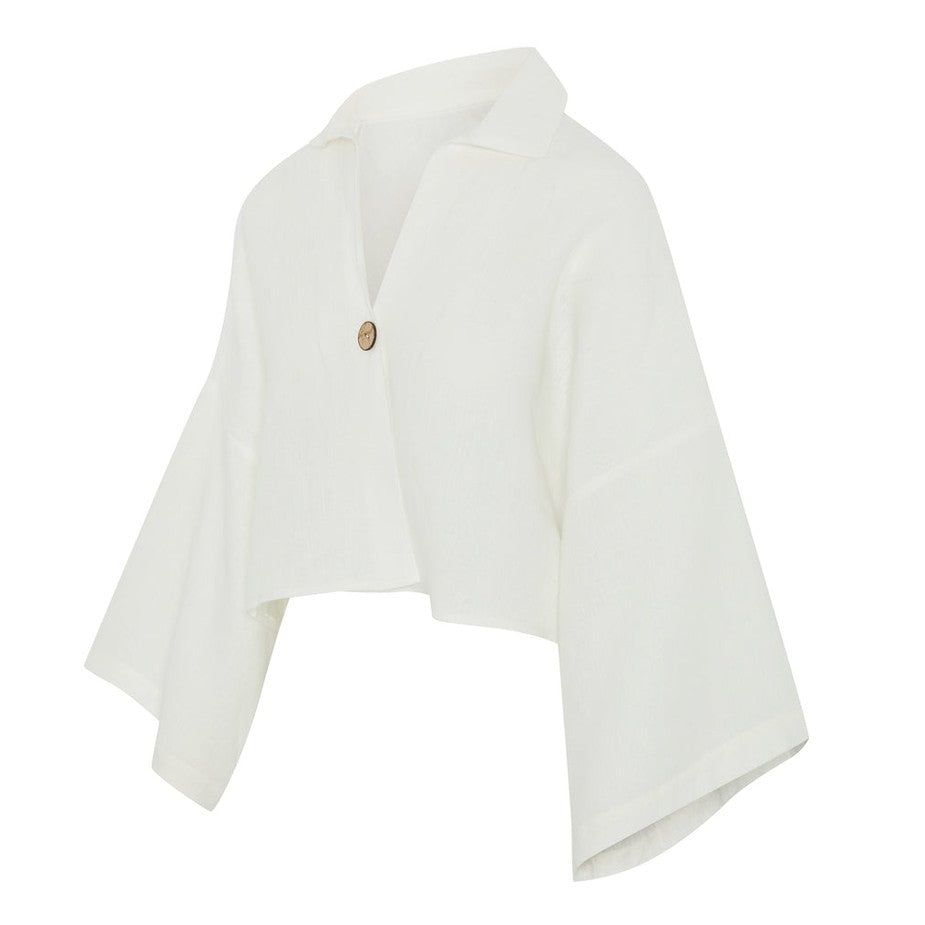 White cape shirt with a button on a white background
