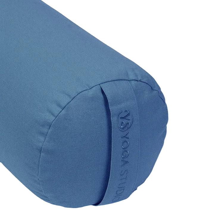 Blue yoga bolster with 'Yoga Studio' branding on a light gray background