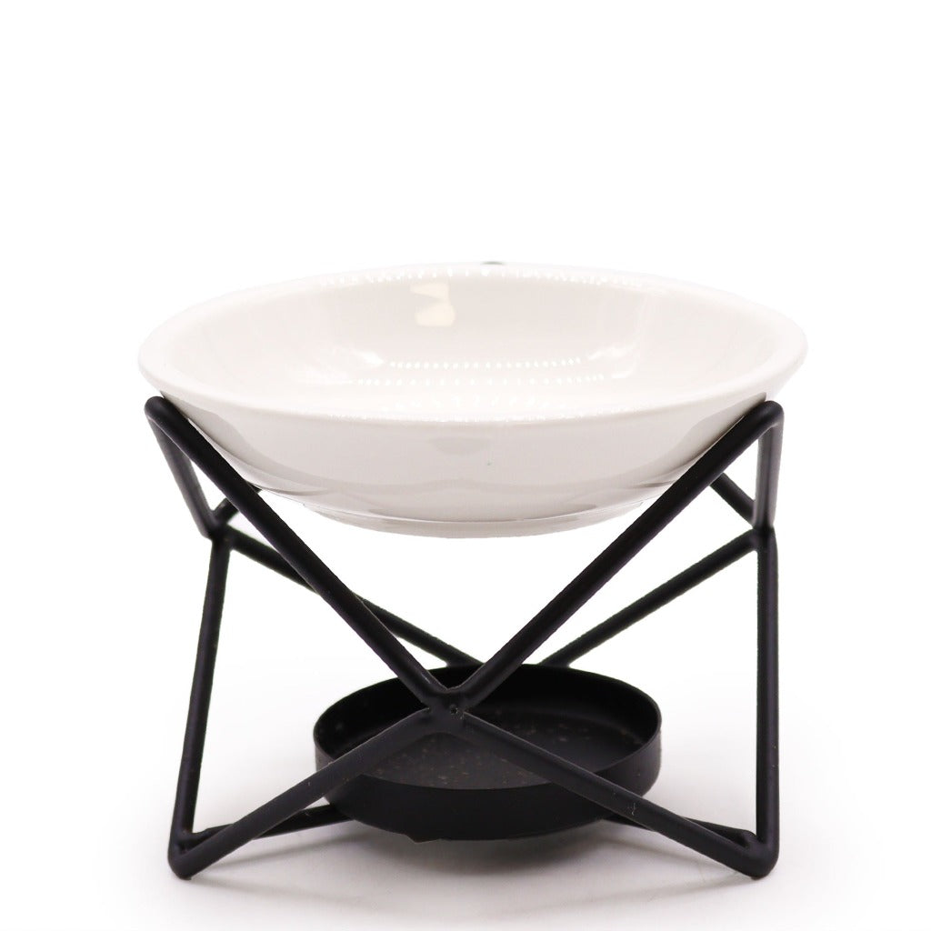 Wax Melt Burner - Ceramic & Metal Oil Burner - Black & White - 4 Designs. Designed with precision, this simple stand blends form and function seamlessly. It's the perfect choice for diffusing fragrance oils, simmering granules, or enjoying Wax Melts, transforming any room into a tranquil retreat.