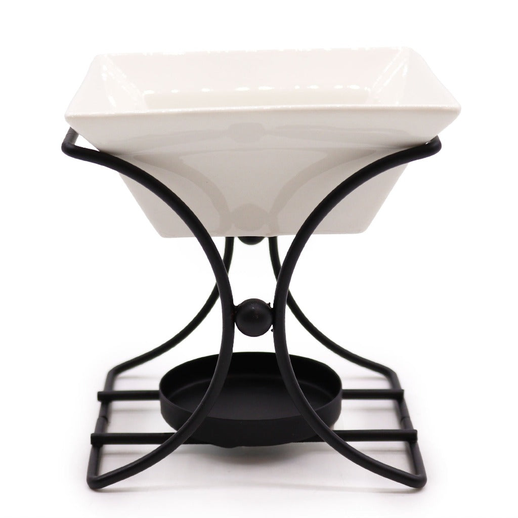 Wax Melt Burner - Ceramic & Metal Oil Burner - Black & White - 4 Designs. Designed with precision, this simple stand blends form and function seamlessly. It's the perfect choice for diffusing fragrance oils, simmering granules, or enjoying Wax Melts, transforming any room into a tranquil retreat.