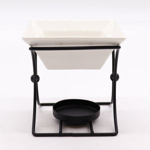 Wax Melt Burner - Ceramic & Metal Oil Burner - Black & White - 4 Designs. Designed with precision, this simple stand blends form and function seamlessly. It's the perfect choice for diffusing fragrance oils, simmering granules, or enjoying Wax Melts, transforming any room into a tranquil retreat.