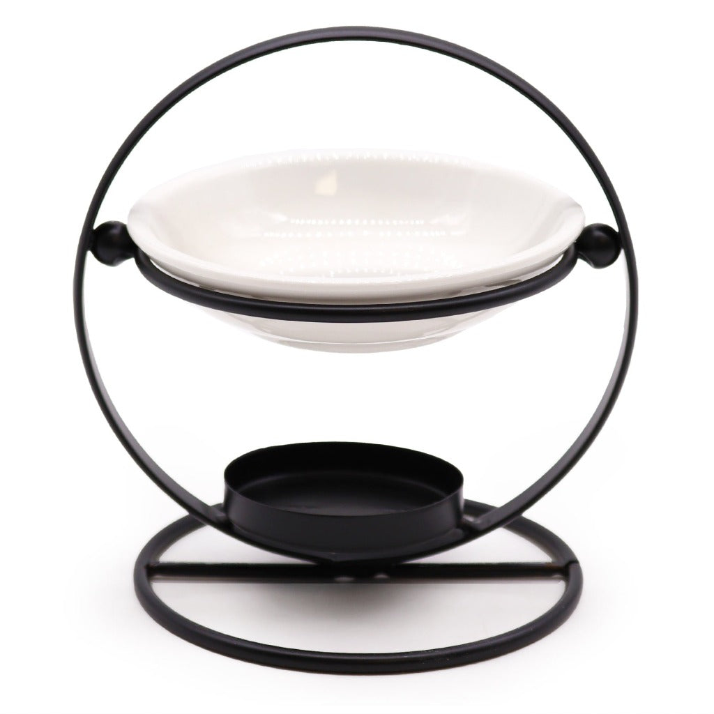 Wax Melt Burner - Ceramic & Metal Oil Burner - Black & White - 4 Designs. Designed with precision, this simple stand blends form and function seamlessly. It's the perfect choice for diffusing fragrance oils, simmering granules, or enjoying Wax Melts, transforming any room into a tranquil retreat.