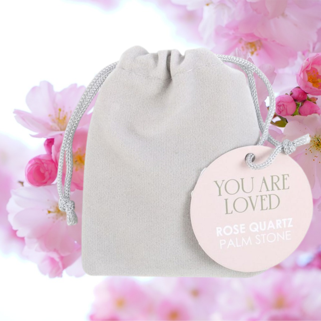 Emmy Jane Boutique - Rose Quartz Crystal Palm Stone - You Are Loved - Romantic Gift for Her. This healing rose quartz palm stone is accented by engraved gold-toned 'you are loved' text, making it a meaningful token of love and care. Presented with an informational insert card and drawstring bag for safekeeping.