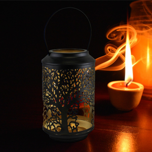 Emmy Jane - Black Candle Lantern - Tree Of Life Design - Black Tealight Candle Holder. A beautiful candle lantern in black with a golden interior featuring our tree of life design cutout around the lantern. Will hold a tealight candle. The lantern is made of 100% iron and features a handle for carrying or hanging. Measurements: 10 x 17 x 10cm.
