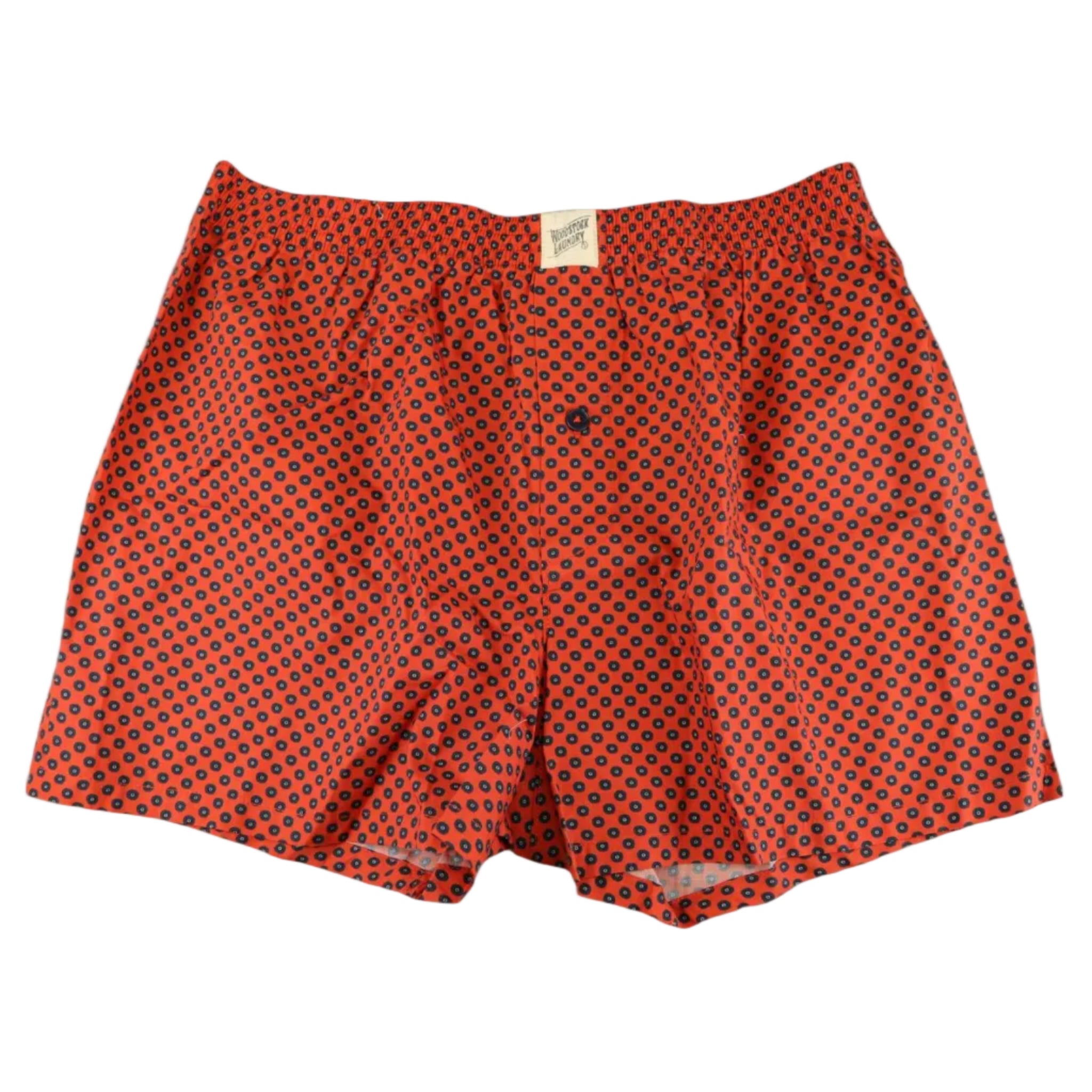 Red boxer shorts with blue polka dots on a white background