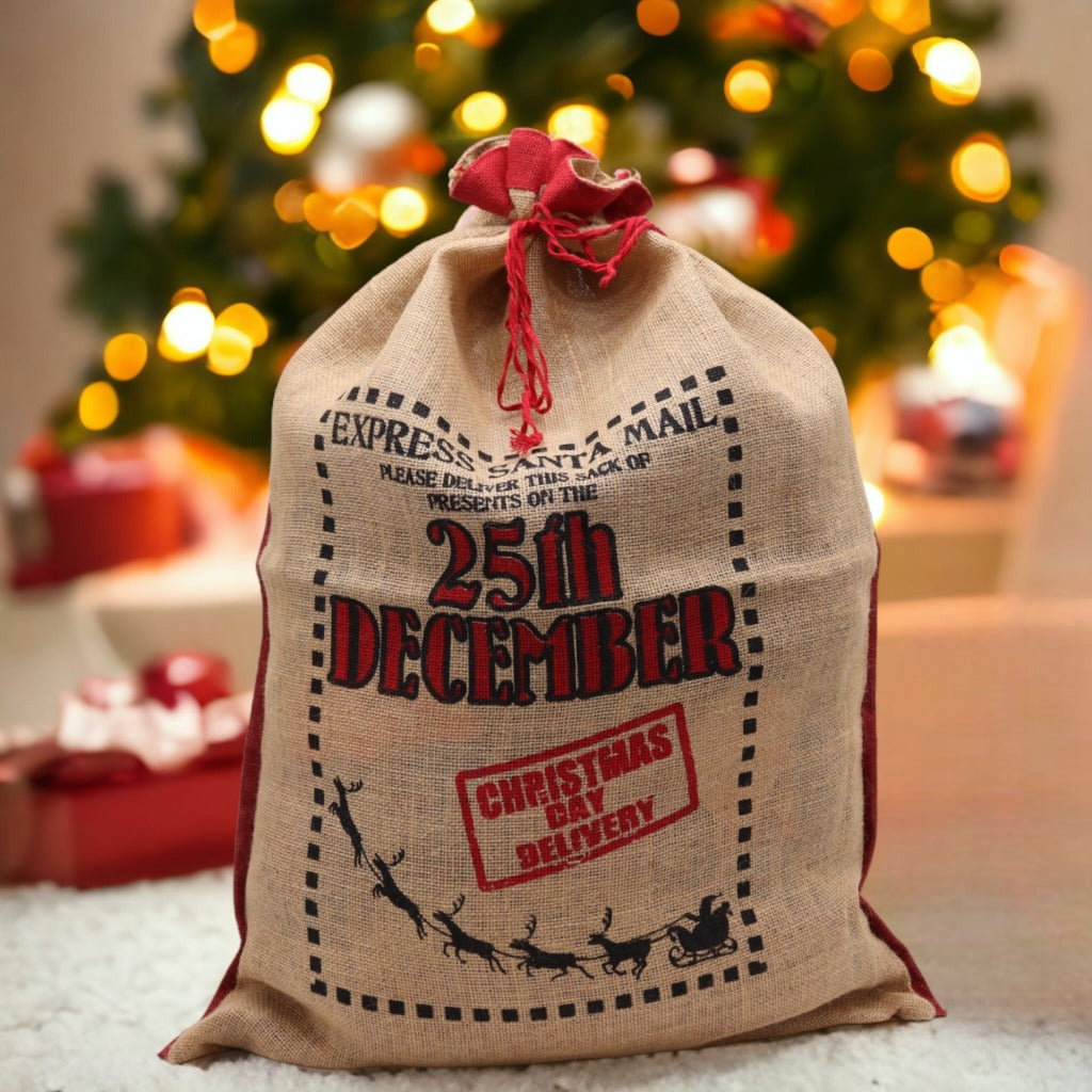 Reusable Christmas Present Bags - Santa Sacks - Natural Xmas Stockings. This wonderfully festive Jute Sack is strong and sturdy. Fill it with presents for your friends and family and also reuse it next year so you can get plenty of use out of it. Made in India. Available in four different designs. Colour Natural Black and Red. Size of the Jute Santa Bag: 76cm x 55cm Size: H: 76 cm; W: 55 cm. Material Jute