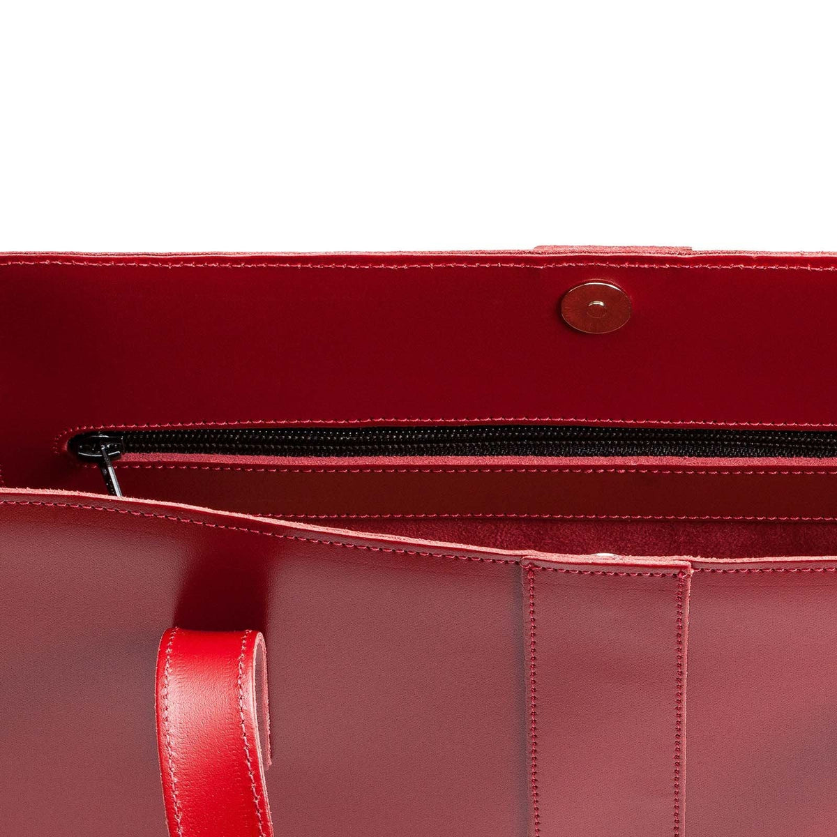Inside the red Zatchels leather shopper, showing its magnetic fastening and zipped side pocket