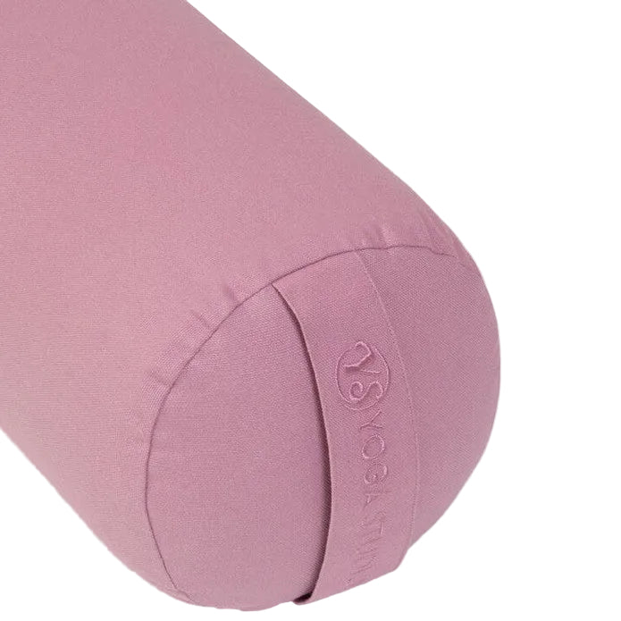 Pink yoga bolster with a brand logo on a light gray background