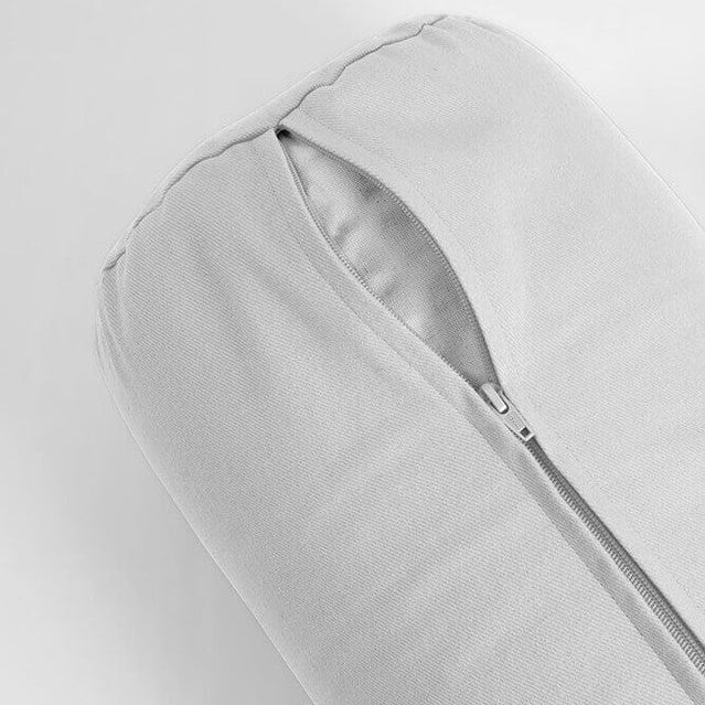Light grey yoga bolster on a light grey background