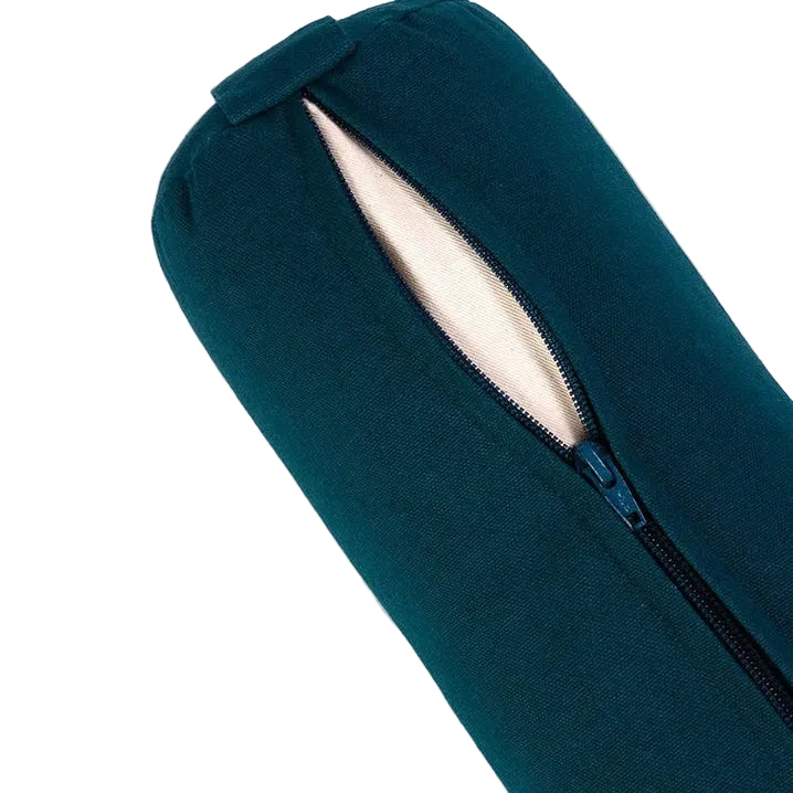 Close-up of a dark teal yoga mat with a partially unzipped end showing a light beige fabric lining, set against a plain light gray background.