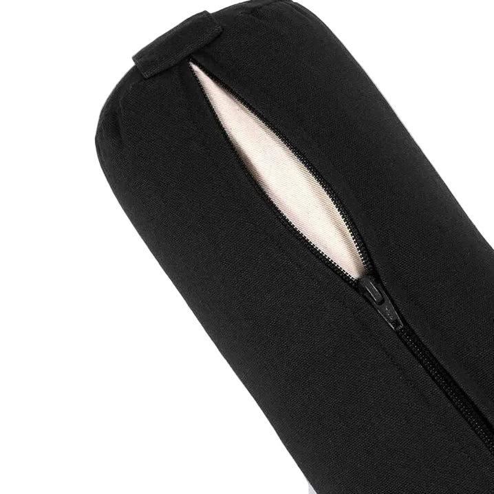 Close-up of a black cylindrical zippered yoga bolster sleeve or case with a black zipper and a light beige interior lining, shown on a plain light background.