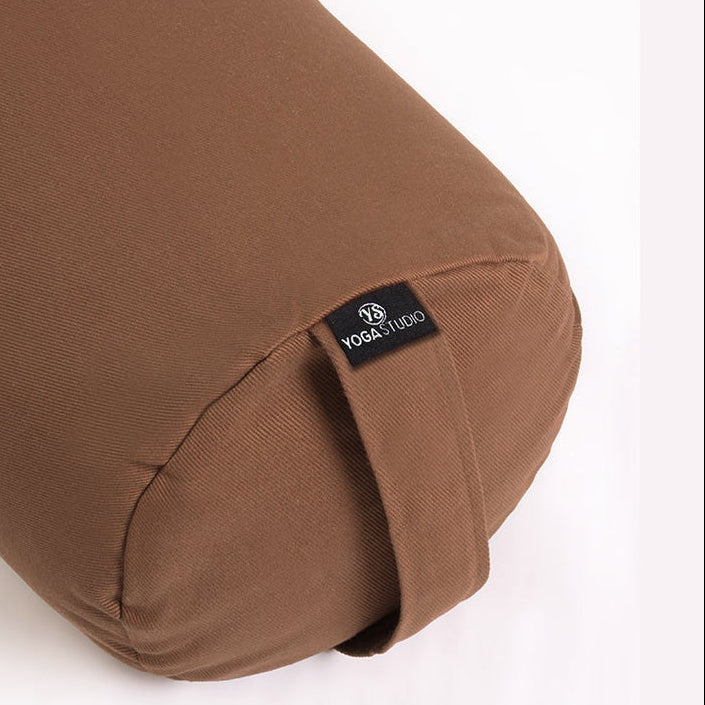 Brown yoga bolster with a visible brand logo on a white background