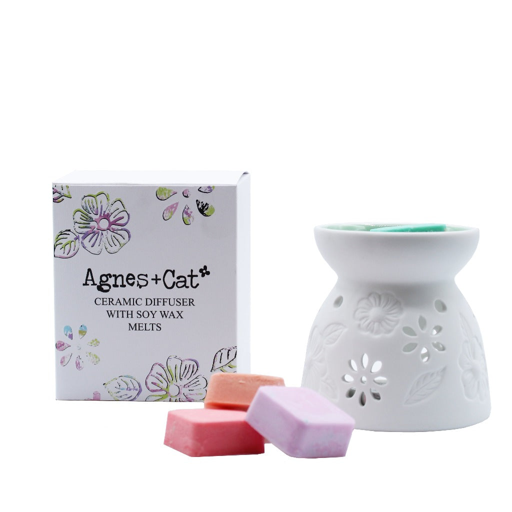 Emmy Jane - Ceramic Diffuser Gift Set with Soy Wax Melts from Agnes+Cat. Each oil burner has a pretty floral design, with leaves and flowers which allow the candlelight to shine through creating that relaxing atmosphere.  Each diffuser comes with 4 soy wax melts: Seasalt & Moss, Tea and Roses, Rhubarb and Parma Violet.