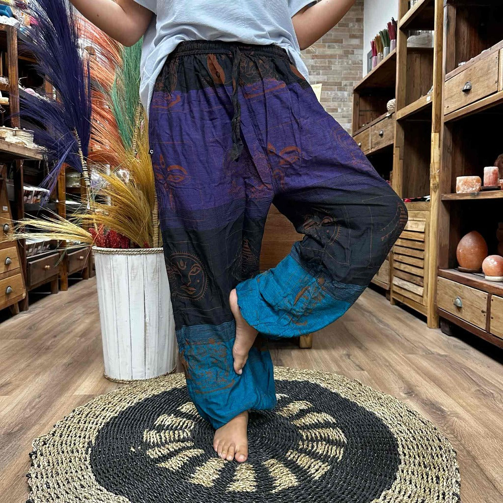 Cotton Yoga Trousers Comfy Festival Pants - Colourful Himalayan prints.a full range of Yoga and Festival Pants for you, all made from 100% cotton. These pants are made in Nepal and are super soft, lightweight, and stylish. They come in one size that fits everyone, making them a great choice for most people. Plus, we deliver these yoga and festival pants in a small cotton bag to add a special touch. The collection features three styles: High Cross, Aladdin, and Fisherman